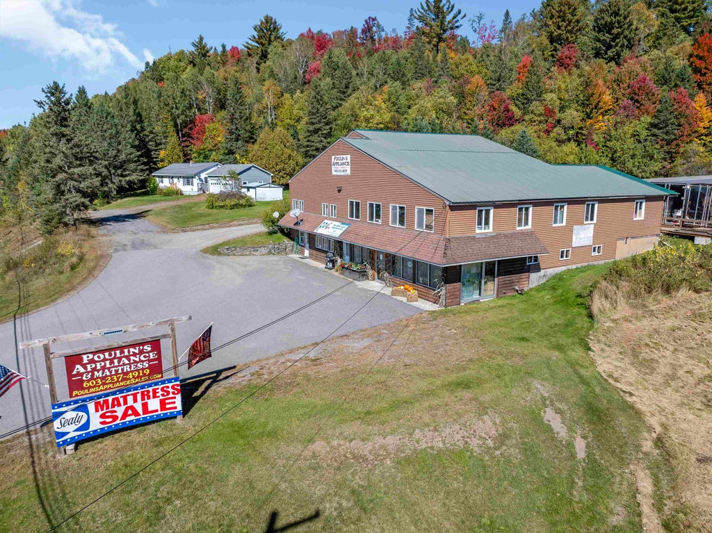 Photo of 102 Trooper Leslie G Lord Memorial Highway, Colebrook, NH 03576 (MLS # 5112639)