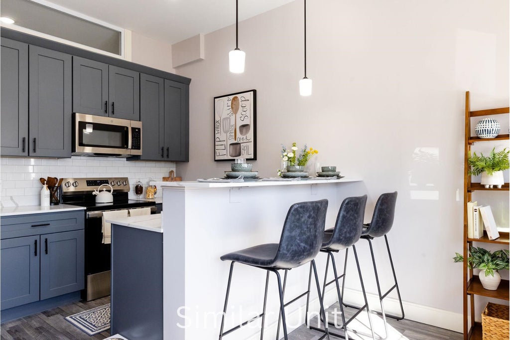 Photo of 1555 Elm Street #102, Manchester, NH 03101 (MLS # 5101811)