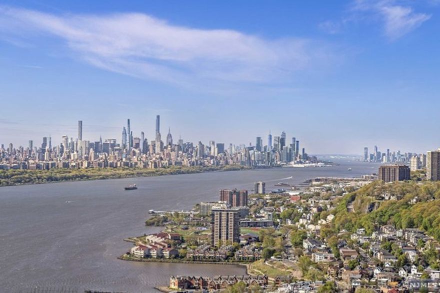 High in the Sky! Dream Views of Manhattan Skyline from every room! Conveniently located next to George Washington Bridge, illuminated with Southern Sunlight all day log! Spacious 986 sf, Airy, Lofty High Ceilings overlooking the entire stretch of the iconic city of Manhattan from the 40th fl of a 46 story hi rise! Freshly painted, new stove/microwave, dishwasher, laundry, LED lighting throughout. Primary bath w/ new vanity LED mirror plus new white quartz counter. Powder room w/ new vanity. New toilets. Easy commute via GWB, walk to everything - restaurants, shops, supermarkets, parks, schools, NYC transportation. Includes 2 in building garage spaces! Full amenities featuring 24 hr concierge, outdoor pool, gym, playroom, event room, dry cleaner on site. Walk in Closet, Formal Dining area.***No pets, No smoking permitted***