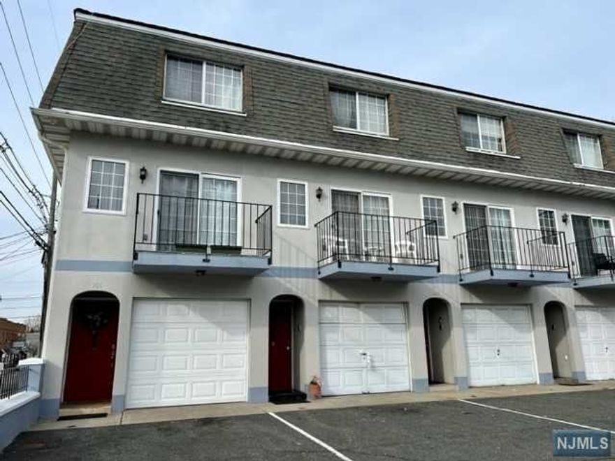 Welcome to this townhome that is located within a close proximity to mass transit, shopping, schools and parks! This home features a garage and parking space, as well as an office/den and back entry on the ground floor. First floor features an eat-in kitchen, half a bathroom, living room and a balcony. Second floor offers 2 bedroom and 1 full bathroom. Hardwood floors throughout, central AC and baseboard heat. Call today to schedule your tour!