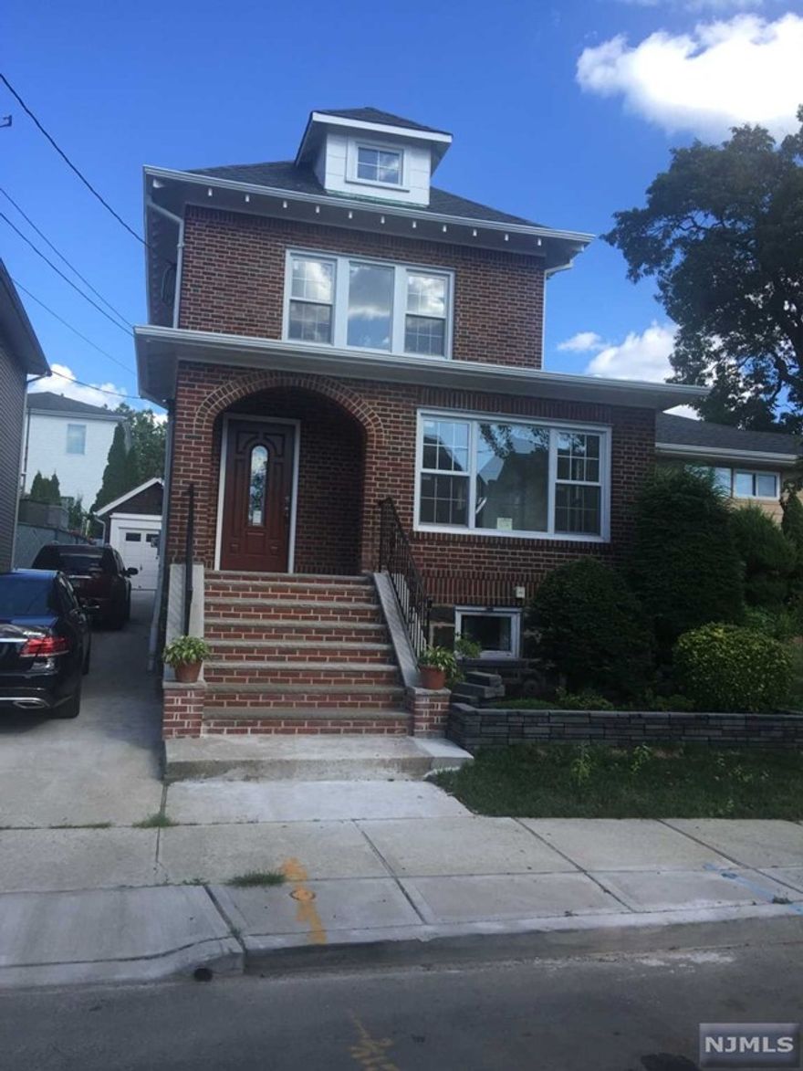 Renovated one family house with finished basement full bathroom, washer/dryer and summer kitchen. First floor has living room with fireplace, computer room, dining room, kitchen with an island and granite countertops, sun room and half bathroom. Second floor has 3 bedrooms and a full bath. Finished attic with open space. Fits up to 4 cars in driveway and a 2 car garage. Great location. Half block from parks, middle/elementary school. Walking distance to bus stop/NYC transportation.