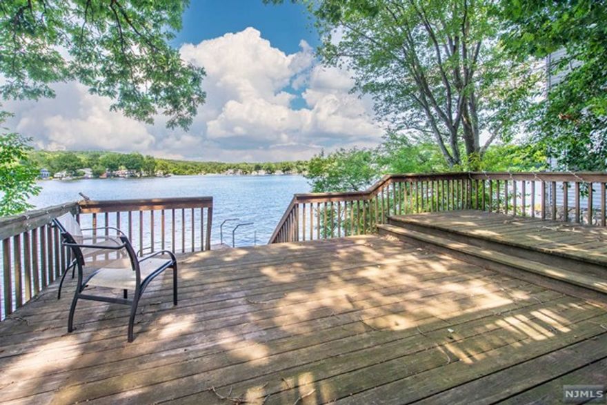 Lakefront Apartment with stunning, year-round views. Open floor plan, spacious living space on one floor. Bedroom overlooks lake as well. Enjoy lake lifestyle w/ your own deck & dock. Great location! Extras include a half bath -nice for entertaining. Large laundry room & storage area and/or a 2nd smaller bedroom. Additional storage in basement. The location can't be beat. Indian Lake offers lots of joy w/ swimming, boating (motor boats, kayaks, canoes allowed), fishing, ice-skating in the winter or just plain ol' relaxation -taking in the scenery & great community energy.* Denville is the Hub of Morris County w/ NYC direct train & buses. Near Rt. 80, 287, 46 and 10. A walkable DWTN with plenty of shopping, restaurants - all that is needed to make life simple & convenient. (*ILCC membership required to use beaches & boats)