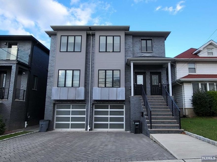 OVERSIZED 3 bedrooms & 2 bathrooms unit on the 2nd floor. Built in 2020 and almost brand new condition. The South faced a unit with a lot of natural lights. Modern open Layout floorplan with a spacious living room and dining room. A master suite features a luxurious, spa-like, in-suite bathroom with double vanity and large walking-in closets with custom built racks. Modern style kitchen with stainless steel appliances and laundry in-unit for convenience. Also, this unit has a large deck that can be useful for family entertaining. One indoor garage and one additional parking space on the driveway (in front of the garage) Short walking distance to NYC bus, shops and restaurants. Also, close to major highways. NO PETS.