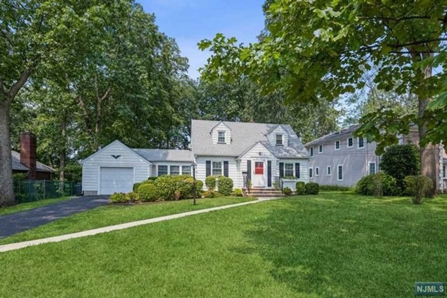 Picture perfect Cape Cod in excellent condition. First Floor Features a living room, dining room, modern eat in kitchen, bedroom and full bathroom. One car attached garage with 3 season breezeway room with access to the house. Second floor features 2 bedrooms and a full bathroom. Full finished basement with wet bar, laundry room and storage. Huge private backyard perfect for your enjoyment. Excellent location in Fair Lawn near schools and parks.