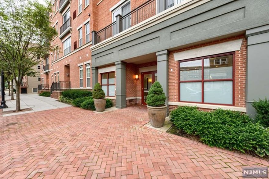 Corner South & West Facing 2 Bed, 2 Bath with a Private Balcony and Garage Parking included in Crescent Court! The windowed kitchen features dark expresso cabinetry, granite countertops, stainless steel appliances, a breakfast bar and plentiful cabinet/countertop space. The large kitchen opens up into the dining/living room area which overlooks the tranquil court yard. The spacious master bedroom is highlighted with South & West Facing Windows and a large walk-in-closet with custom built-ins. The windowed en-suite master bath is equipped with a double vanity. A laundry room with side-by-side washer & dryer, central AC/heat controlled by a NEST thermostat and garage parking included (with additional storage in front) rounds out your perfect new home. The building also has common landscaped court yard and bike storage. Conveniently located near the Grove PATH, nightlife, restaurants and shops!