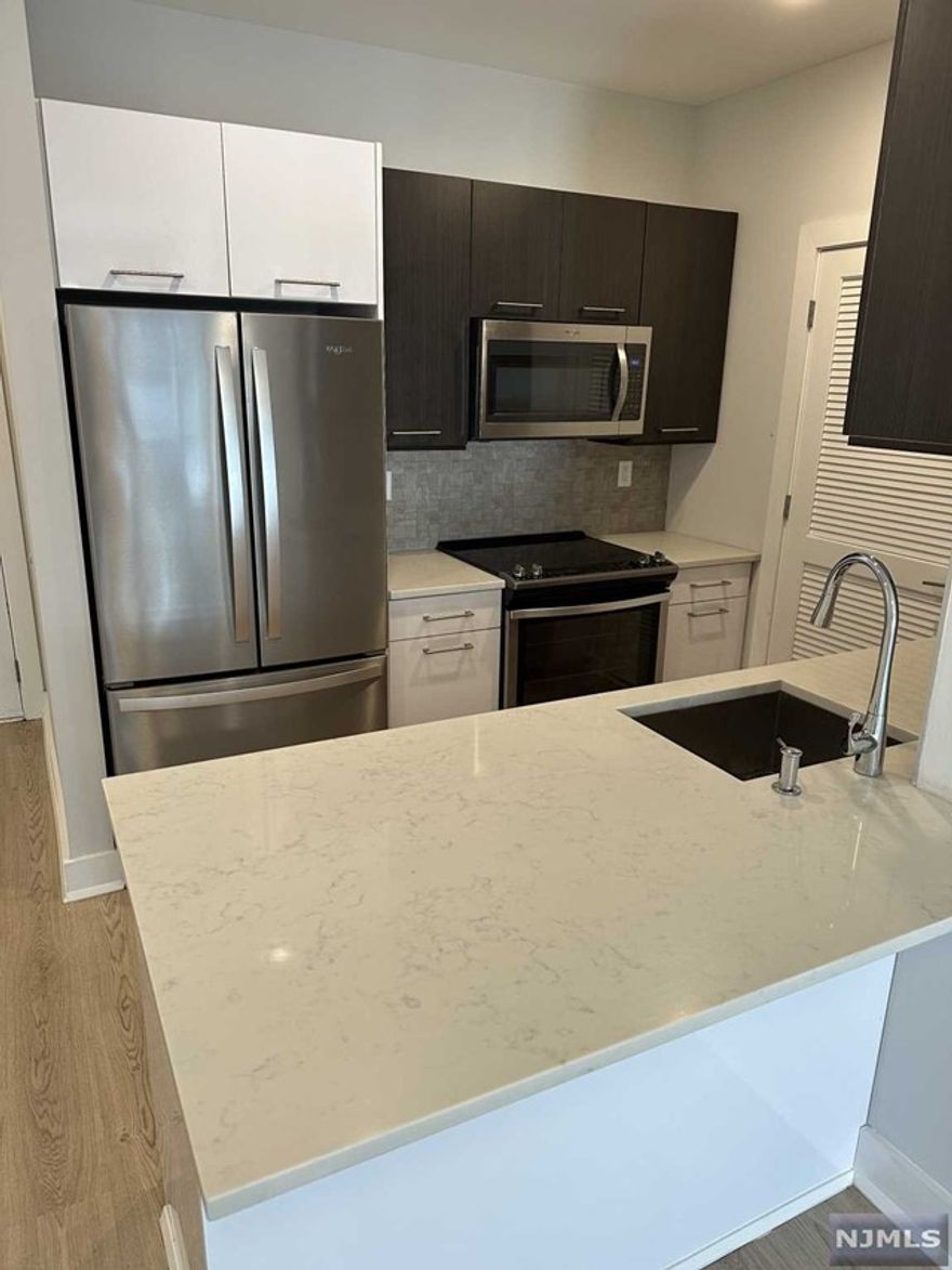 Fort Lee's 44-unit luxury rental building - Sylvan Ridge - Sylvan Ridge features modern units with spacious floorplans & high end finishes. Some highlights include: beautiful modern kitchens w/ stainless steel Energy Star appliances, full kitchen island, wood floors, shades on all windows, large washer and dryer in each unit,.One parking spot included in the rent; 2nd space: $100/month. Spacious lounge area with beautiful fireplace, TV, couches, free Wi-Fi, fitness center & outdoor terrace (included in rent). Block away from the George Washington Bridge and all major highways. Within blocks to all Fort Lee has to offer including brand new stores, restaurants & movie theater. Tenant responsible for electric. Pet friendly (25 lb limit) $400 pet fee + pet rent per month. Reduced security for qualified tenants.