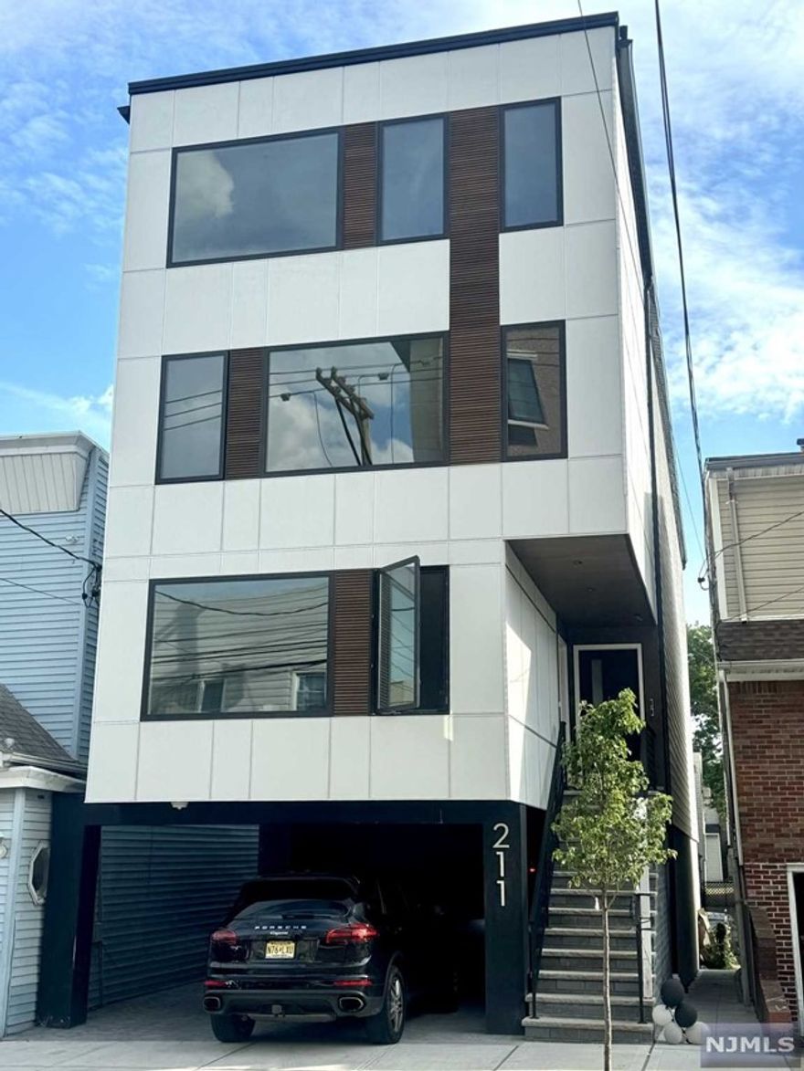 Designed and built by SILVERLINE, this contemporary 2-level condo boasts 3 bedrooms, 2 full bathrooms, and 1 half bathroom. Located just blocks away from BLVD East and steps from direct transportation to NYC, it offers a sophisticated and convenient living experience. Meticulously designed with top-tier finishes, both levels showcase wide plank European White Oak Flooring. The main level is illuminated by large Anderson Windows, filling the space with natural light. The open concept layout features a European chef's kitchen, dining area, and living room. On the upper level, discover 2 large bedrooms accompanied by 2 full bathrooms. The property is equipped with High Efficiency Heating & Cooling, separate water, electricity, and gas services, and includes a dedicated parking spot for added convenience. Owner holds NJ Real Estate license.