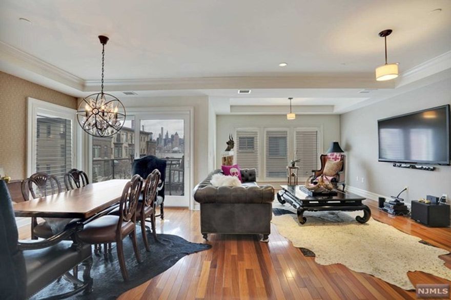 World-class luxury awaits you in this unrivaled condo located at prestigious Henley on Hudson. A contemporary and ultra-sleek oversized 2 Bed/2.5 Bath suite where every attention to detail was captured in this immaculate and well kept home. With a well very designed layout of one floor living, this home provides it all within its 1,640 SqFt of living space. State-of-the-art professional kitchen, gleaming wood flooring, en-suite primary bedroom w/a large walk-in closet, spacious bedrooms and outdoor balcony with NYC views amplify the feeling of a personal everyday retreat. The exclusive community of Henley on Hudson is located along NJ's Gold Coast w/an easy commute to/from the City via NY Waterway Ferry or NJ Transit Bus & situated within easy distance to the Hudson Bergen Light Rail. The community offers a concierge, 2 state-of-the-art fitness centers, sauna, lounge, billiards, a waterside promenade, playroom, infinity pool & jacuzzi w/stunning views of NYC & Hudson River.