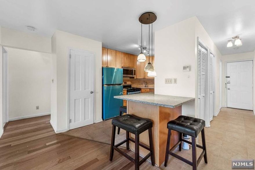 Prime Blvd East location! This charming, top floor 2BR condo features an open concept living area and brand new SS appliances (fridge, range, built-in microwave, and dishwasher). Newly renovated marble bathroom. Large primary bedroom and front bedroom w/ partial river views. Perfect location for commuters with NYC bus stop at your doorstep. Deeded storage space in basement round out this great opportunity. Schedule your viewing today! Landlord is a licensed Realtor.