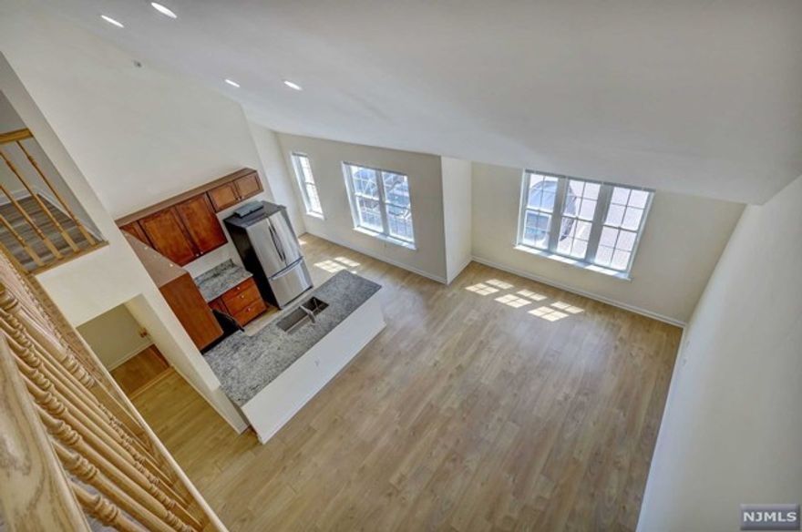 Amazing townhouse rental community in the heart of Little Ferry,surrounded by private,parklike gardens and barbecue area,a common area for tenants only.This unit is a duplex layout and has a 500sqft lofted area in addition to the first level floor with 2BR and 2 full Bath,a large master bedroom with a walk in closet and an en-suite bathroom.A beautiful gourmet kitchen featuring all stainless steel appliances,ample storage space,a large breakfast bar/iland with granite countertops,cathedral ceilings and recessed lighting, wood floors throughout,central air,a washer/dryer and Verizon Fios or Spectrum for internet and cable tv are other highlights included The loft area can be an additional family room or any other set up.Many large windows bring in lots of natural light and truly make this a unique Apt.One (1) assigned parking spot is incl.+a 2nd spot would be an extra $75.-/mo.Fantastic location,NJ Bus right outside the complex offers a quick access in and out of NYC,near shopping!