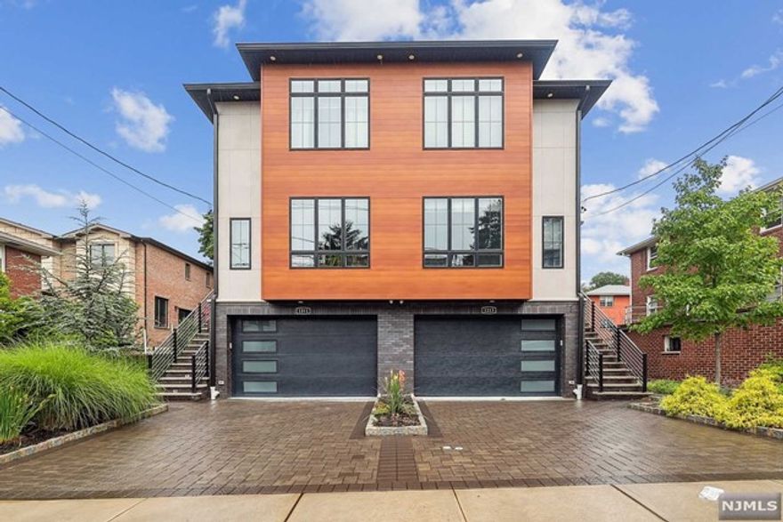 Welcome to 1213 16th St: This modern duplex is only a short distance to parks, NYC buses, groceries and, a local favorite, Urban Tomato. Entering through your 2 car garage, you'll step into the mud room that leads to a fully finished family/recreation area with a powder room, all with heated floors. Moving upstairs, you'll have your separate dining room and kitchen on your left and your 2nd powder room and living room on your right. The living room's Eastern Exposure allows in the beautiful morning sunlight, enlivening the rooms gas fireplace and custom, built-in shelving. The large kitchen is perfect for gatherings, including an 8-seat kitchen-island, walk-out patio, plentiful storage and a 55" TV with security system access. Your second floor bedrooms are large and all bathroom floors are heated. Call Daniel with questions or to schedule a visit: 347-881-6945