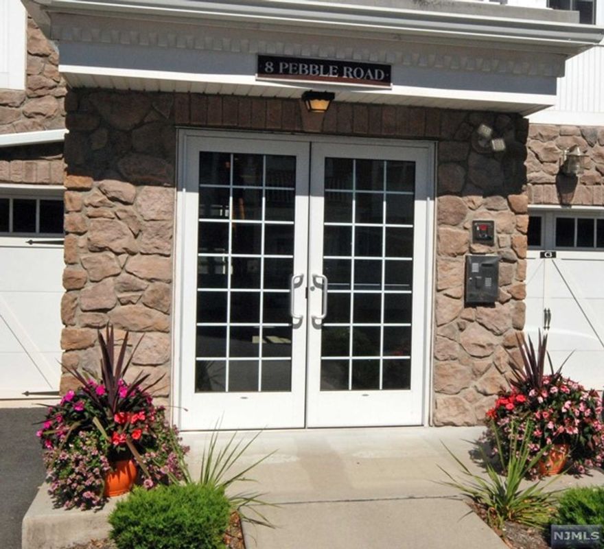 8-Year young IRIS II with over $50k in upgrades & high-end finishes! Meticulously cared for by the original owner, this home is in one of the newer buildings and is truly turnkey. An inviting entrance with a French door that opens to a den which is ideal for an office or hobby. The gourmet kitchen has light cream cabinets and quartz countertops in the perfect blend of colors. An impressive MBR suite with 2 walk-in closets & luxurious bathroom. A private garage with a storage room and a balcony that overlooks a scenic courtyard of shrubbery & trees. Resort style living just 12 miles west of Manhattan featuring an outstanding 25,000 sq. ft. clubhouse w/indoor/outdoor pool, tennis, pickleball, putting green, fitness center, card rooms/Mahjong, clubs, activities & more. Bordering the town of Montclair with terrific restaurants, theaters & shops/boutiques. Experience the joy of one level living in this premier gated community!