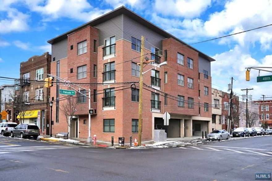 Modern & Renovated corner unit, two bedroom one bathroom condo. Open concept living, throughout a bright and spacious floor plan. Featuring, stainless steal appliances, two Juliette balconies, hardwood floor throughout, in unit laundry, central A/C and heat. A true dedicated dining space, with eastern exposures facing NYC. Spacious master bedroom, with a great sized walk in closet. Convenient location just a few blocks away from Hudson Light Rail Station. Unit includes, deed two car parking plus storage. Low Maintenance and taxes.