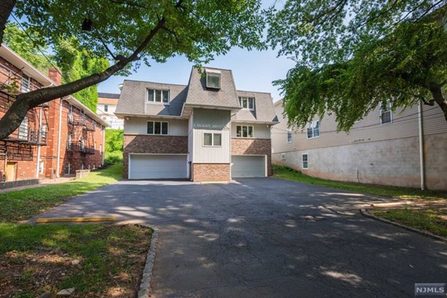 DON'T MISS THIS FANTASTIC BUY! Light and bright 1 bedroom, 1 bath condo conveniently located near all major shopping, restaurants, commuting and amenities. This well maintained home is designed for comfort. An inviting Living Room with tons of natural light overlooks the park across the street. The Dining Room leads to a kitchen with S/S appliances and a nice size pantry closet. The large primary bedroom features 2 generously sized closets w/ lighting and a glass slider leading to your own private deck that overlooks a nice grass yard. Beautiful hardwood floors throughout, updated large full bath, newer washer, dryer and hot water heater. Assigned attached garage with private walk in from the entrance downstairs, on site laundry room with your own washer and dryer and plenty of storage with a pull down attic and storage shelving available in the laundry room and garage.