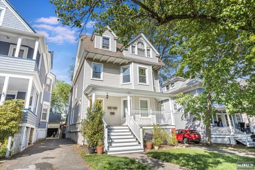 This lovely 3 BR, 1 bath condo in a sweet, well maintained 3 unit Colonial is smack in the middle of Montclair's eclectic downtown! Even better, it includes a deeded garage space & 1 additional outdoor parking spot. Recent updates to this 2nd floor unit include fresh paint throughout, beautiful new red oak hardwood floors, a ductless heat/AC unit, soft close barn doors in the living room, new stainless steel appliances & much more. The sunny & bright living room features oversized windows & high ceilings, & the eat-in kitchen offers a 6 burner range, granite counters & convenient under counter washer/dryer. There is ample cabinet space & a charming original built-in pantry. With three BR (one is captured), there are multiple options for WFH and/or guest room, good closet space & hardwood floors. There is additional storage space in the basement. Nearby Walnut Street train station makes for a quick NYC commute. Shopping, dining, & entertainment just a few short blocks away.