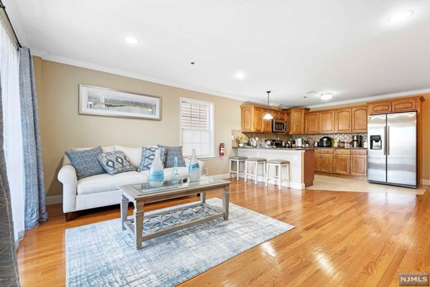 Pristine, sun-filled 3 bedroom duplex on a quiet cul-de-sac with a private backyard in Guttenberg! This 3 bedroom/3 full bathroom condominium is over 1850 sq.ft. and features a garden level "bonus" room/ guest suite with private entrance opening to your own backyard oasis! Warm hardwood floors throughout, recessed lighting, and an open floor plan make entertaining effortless. The designer kitchen features wood cabinets, granite counters, stainless steel appliances and large breakfast bar. The primary bedroom has a walk-in closet and elegant bath complete with jacuzzi tub, porcelain tile and granite top vanity. Two additional full sized bedrooms perfect for guest room and a home office. Additional features include central air conditioning & heating, washer & dryer in the unit and tandem garage parking for 2 cars as well as space for 2 cars in the driveway! Commuting to Manhattan could not be easier...the NYC bus is on the corner!