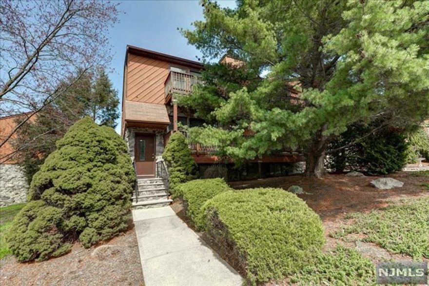 Desirable Brookside Heights Townhome. This townhome features balconies off the kitchen as well as both bedrooms. The first floor has an updated kitchen with granite counter tops SS Refrigerator, updated powder room, large dining room with crown molding, living room with wood burning fireplace and access to deck. Master bedroom suite w/ walls of large closets, private updated bathroom, sliders to large deck & views. Additional large bedroom w/ deck & bath. Finished lower level: rec room, storage, laundry & private garage Wonderful space for all your lifestyle needs. Crown molding, recessed lighting & all ready to move in! Great location. Minutes to shopping, restaurants & major highways. Great opportunity & beautiful views!