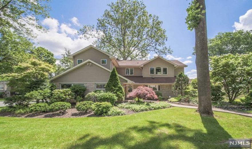 Bright and spacious home in convenient Tenafly location. Features include a fireplace in the living room, French doors leading to the deck from the dining room, granite counters in the kitchen with top-of-the-line appliances, a master bedroom with a master bath, and an additional bedroom or office. Upstairs offers a large bedroom with two walk-in closets, two good-sized bedrooms, and two full baths. The finished basement includes a rec room, laundry room, storage, and a two-car garage. Amenities include central vacuum, security system, and water softener salt system. Walking distance to schools, downtown, bus stops, worship places, playgrounds, and the library. Landscaping included; tenant responsible for snow removal.