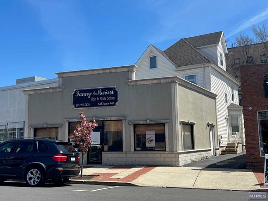 Mixed use property - Store and 2 Apartments w/Driveway and 5 parking spaces. Totally renovated in 2005. All separate CAC and heat units. 1st Floor Rear Apartment w/ 1 bedroom, Living room and large kitchen. 2nd and 3rd floor Apartment has 3 bedrooms. Store is about 1,000sq ft. Rents are below market value: Store is $1500, 3 Bedroom apartment is $1400 & 1 Bedroom Apartment is $1100.