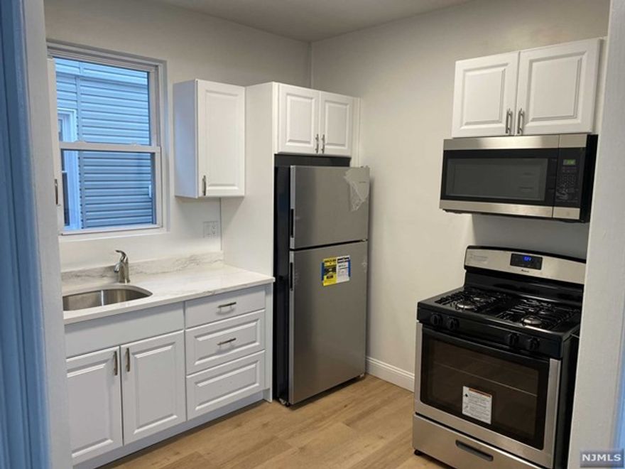 GREAT LOCATION! Renovated first floor 3 bed 1 bath unit with high ceilings and beautiful hardwood floors throughout. New kitchen with granite countertops and stainless-steel appliances, porch and basement with laundry. Covered porch for first floor unit only. Laundry available in basement. Each unit has separate washer and dryer in basement. Use of gated back yard. Parking available for additional fee. Credit and income verification required NO PETS