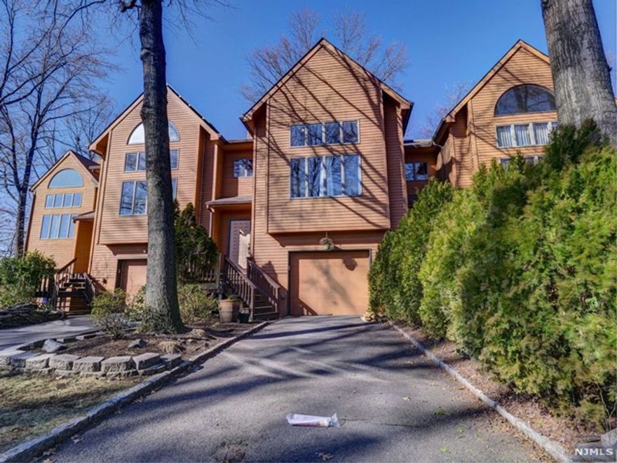 Great opportunity to own this multi level townhouse renovated in 2017. Custom features include vaulted coffered ceilings, beautiful wide trims and moldings, custom wainscoting, columns, and built in cabinetry. Hardwood flooring throughout. Spacious Living Room with Fireplace and Formal Dining Room, Eat in Kitchen with dining area has beautiful cabinets w/granite counters, tumbled marble floors & backsplash, 2 wine Refrigerators and sliding glass doors to deck. The 2nd floor includes 2 Bedrooms a large marble bath with whirlpool tub and separate shower stall. The ground floor has a large room perfect as a Family Room or Bedroom Suite with a beautiful bathroom and Andersen Sliders to patio. 2017 Roof, gutters, leaders and central air unit. No Association fee for this townhome!