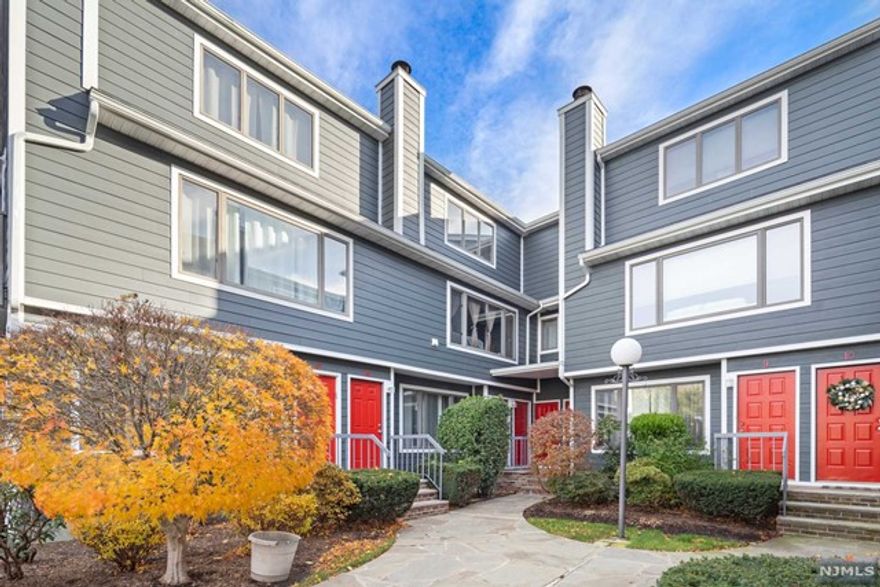 Lovely Townhouse for sale in Little Ferry! This unit features on the 2nd floor a living room with wood burning fireplace and balcony, dining area and kitchen. Walk upstairs to your master bedroom with updated full bathroom. Additional 2nd bedroom, updated full bathroom, and stackable washer/dryer. Hardwood floors throughout, forced hot air, central AC, new roof and siding throughout the whole complex, and two assigned parking spaces. Across the street is a nice park and the unit is located near transportation, shopping, restaurants and schools.