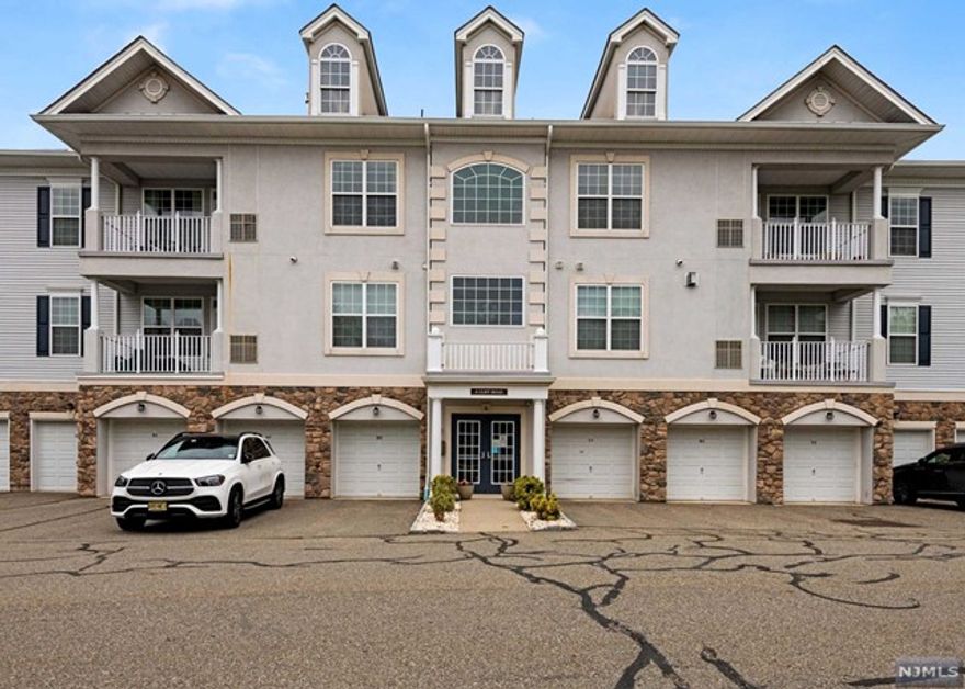 Beautiful Four Seasons at Great Notch gated community 3rd floor Begonia model in lovely elevator building features an open floor plan and tasteful finishes. Laundry in unit. Private one-car garage with storage room. Resort-like amenities and skyline views. Close to conveniences, Routes 46 and 3. Be in Manhattan in 25 minutes!