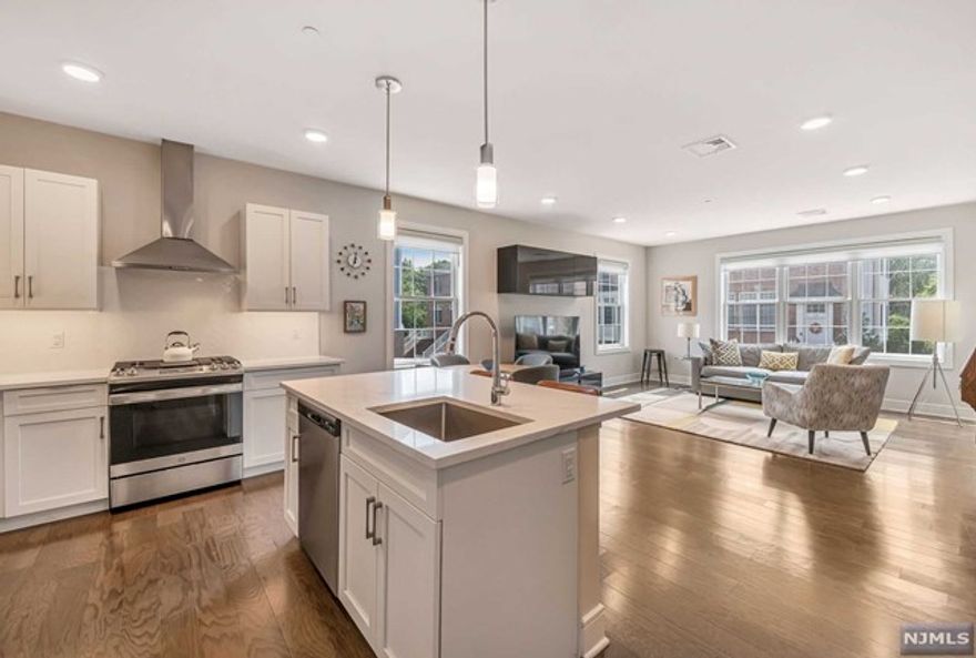 The only available condo & it is an END UNIT! LIVE WELL in the desirable, 50+ active, full amenity, friendly community Paris Square! Experience the beauty as you enter the designer detailed, luxurious elevator foyer from one of your 2 indoor, assigned parking spots. An ease of living is apparent w/ one floor living & upon entering your spacious unit while seeing the gorgeous, sunny, open design showcasing the stunning MEIK w/ multiple seating/dining areas, 2 spacious bedrooms & 2 full baths, including the magnificent Owner's Suite. Energy efficient systems, designer detailed kitchen & baths, hard wood flooring, stunning light fixtures, stone counters & W/D in unit! Amenities include clubhouse w/ fireplace, kitchen, gym, pool, theater, community garden, putting green & walk path thru 64,170 Sq Ft of landscaped park! Near golf, shopping, restaurants & trans! Social Community in a Beautiful Setting w/ LOW HOA fees! Structures not in flood zone, HOA pays any flood insurance.