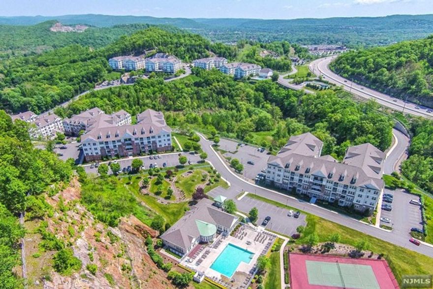 Welcome to The Grande, desirable and limited Firethorne floor plan, 2 bedrooms, court yard views & low taxes. Wonderful open layout and perfect for entertaining. Large kitchen with plentiful of cabinets and counter tops. Convenient breakfast bar for daily use. Large living/dining room with lots of windows which brings in plenty of natural light. 2 bedrooms, 1 full bathroom, office/tech center/storage area with additional closet and full size washer and dryer located in your home. New carpeting 6/30/22. Live the Grande lifestyle w/ 2 clubhouses, 2 pools, 2 gyms, billiard rooms, party rooms, meeting rooms, kitchens, basketball & tennis courts. Great location, close to shopping, restaurants, major highways and minutes to the NJ Bus/Train Center too. Come enjoy life at the Grande!