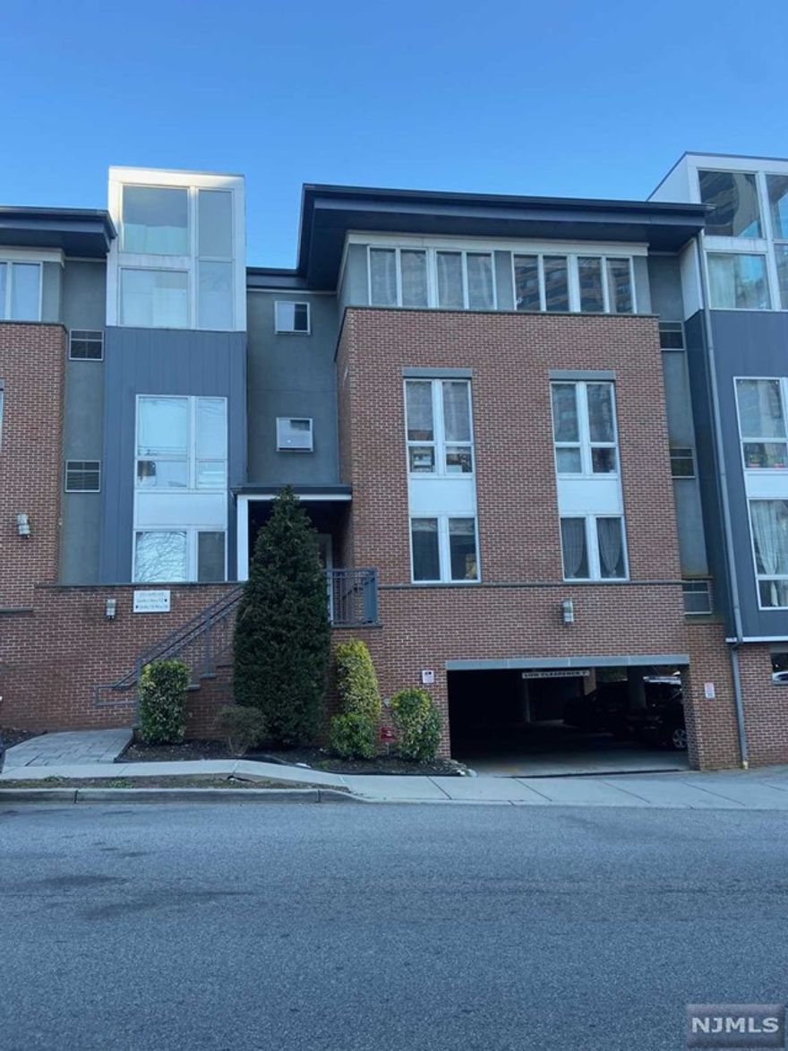 Nice and spacious 2 bedroom, 2 full baths condo with hardwood floors and high ceilings. Kitchen with Brookhaven wood cabinets, granite counter tops and stainless steel appliances. Washer and dryer in unit. Two indoor parking spaces included. Close to shops & restaurants. Easy access to NYC transportation.