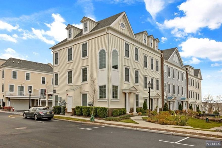 Experience Style & Luxury in Wood Ridge's most sought after townhome community of Wright Place. A timeless colonial is sophistically designed, boasting 3BR/2.2BA, 2,258sqft (approx). Upon your arrival, get greeted by a professional manicured emerald green courtyard that takes you to the grand front entrance. The home will impress you with its Tall Ceilings & Tall Windows, large deck for recreation, storage closets, spacious 2 car garage, & thoughtfully designed spaces for gatherings. On the 2nd floor you have your open layout living-dining-kitchen areas. The kitchen offers granite countertops, white cabinetry, pantry & breakfast nook area. Head upstairs to find a luxe primary bedroom w/tray ceilings, his&her closets, & an attached en suite (Don't miss the Usable Attic Space from Master Bedrm) Other features: In-unit laundry, Dual Thermostats, 2 Zone Heating & Cooling, Hardwood Floors. Steps away from NJ Transit train & bus, schools, dog run, kids park, restaurants, etc.