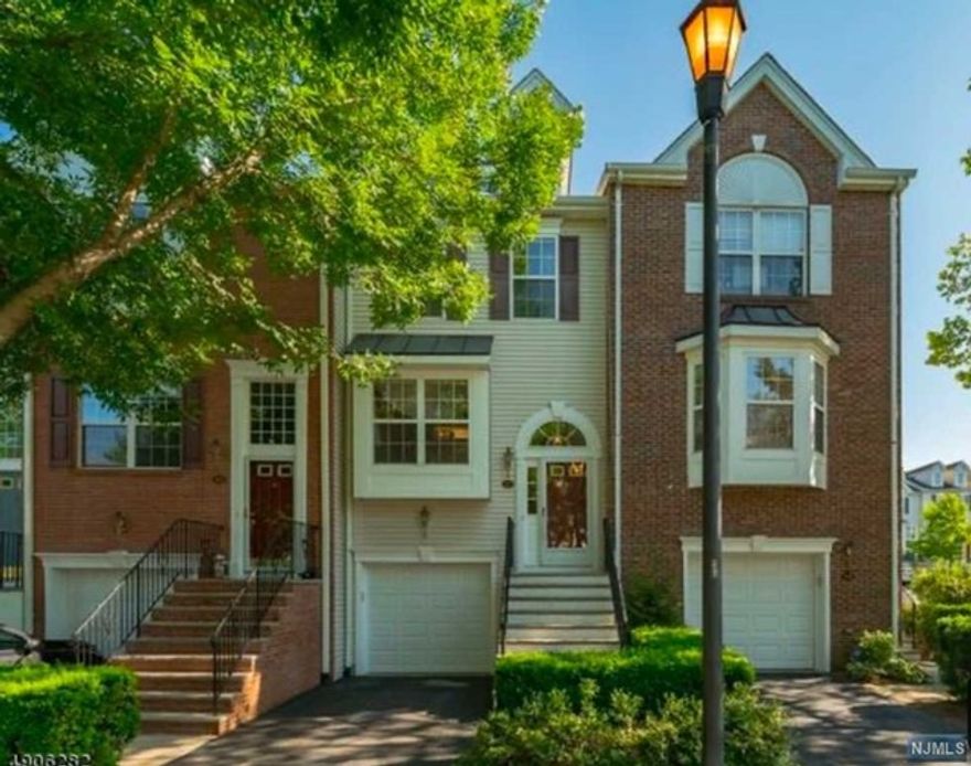 Welcome to this beautiful tri-level townhome in a prestigious gated community just 9 miles to NYC. Enter the main level with an open floor plan that features a living room with a fireplace, dining room & recently updated kitchen open to breakfast nook & powder room. Upper level finds a spacious master bedroom with walk-in closet & en-suite master bath, 2nd bedroom with two closets, 2nd full bath & laundry area with washer and dryer. Huge family room in lower level with additional closets & walk-out to patio to a beautiful common area. Other highlights include high ceilings and hardwood floors. Enjoy the clubhouse with an exercise room, pool, tennis courts, jogging path & playground. Cambridge Heights is conveniently located on major highways and walking distance to NYC transportation, shopping, movies & restaurants. Jitney to train outside the gate and short drive up the road to Seton Hall Medical School.