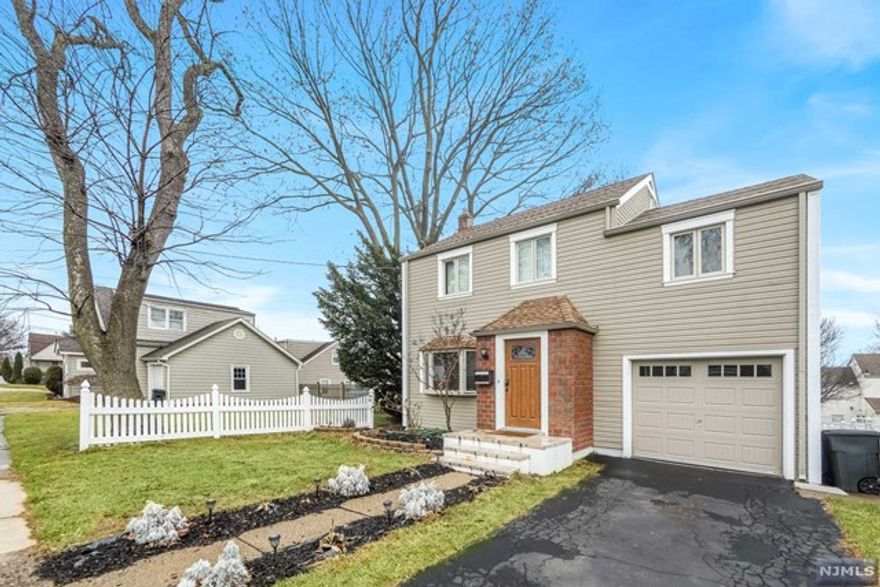 Welcome to this beautiful home with lots of space. Hardwood floors accent the spacious living room and dining room. The chef's style kitchen features stainless steel appliances and custom cabinetry. Off the kitchen is an oversized mahogany deck creating the coveted indoor/outdoor entertaining experience with stairs to the backyard. The first-floor flexible living features an additional room with an en-suite and a full bath with a jacuzzi tub. The 2nd floor adds three bedrooms and a renovated full bath. Walk upstairs to the third floor with a finished room for extra recreation space or office. A full basement offers plenty of storage space and a laundry area/hookups. Central air and a large backyard add to the enjoyment in this tree-lined neighborhood.