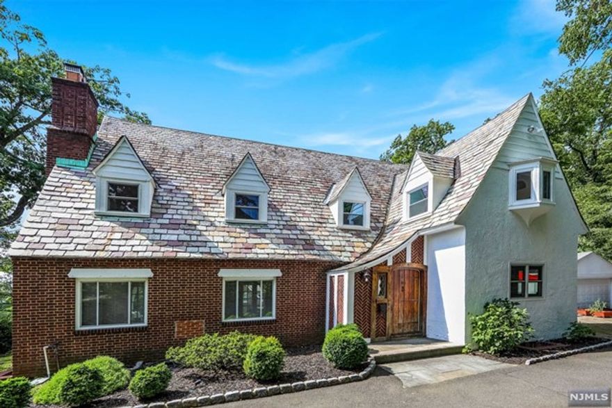 Beautiful 5 bedroom 4 full bath and 1 half bath Tudor Colonial on one of East Hill of Englewood's extremely sought after streets is finally available to rent. Elegantly renovated with a wonderful layout , oversized rooms, and hardwood floors make this home very special. Spacious living room with a fireplace is open to a family room surrounded by windows. The beautiful eat in kitchen boasts high end stainless steel appliances with a Wolf Range and Viking Hood. Gather around the extra large center island with its marble countertop. Powder room, laundry, and guest suite complete this floor. Second floor offers large master bedroom with newer spa like master bath, two additional large bedrooms, and renovated full bathroom , additional bedroom with bathroom ensuite. . Finished basement offers recreation room and great storage. Close to houses of worship, transportation, shopping just six miles from NYC!