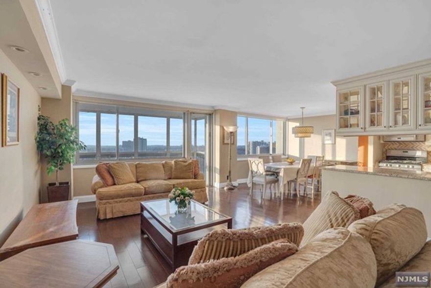 Highest and Best by Sunday, February 18th at 5:00 pm. TOTALLY RENOVATED large one bedroom! This spacious floor plan (approx 1299 sq. ft) includes an a bonus alcove with French doors that has many possibilities, such as a home office, guest area or nursery. Beautiful open kitchen features custom wood cabinetry, a natural stone tile backsplash, granite counters, stainless steel appliances (Fisher & Paykel double drawer dishwasher)and a double sink. Spacious bedroom hosts en suite bathroom with elegant custom tile and a large walk-in shower. Terrace has been enclosed for year around enjoyment. Century Tower is a premier building known for excellent service, and amenities that include 24 hr doorman and concierge, attended garage, heated outdoor pool, kiddie pool, fitness center, children's playroom, BBQ grills and more. Fabulous location near many restaurants, shopping, good schools, Houses of Worship, all highways and easy access to NYC. Parking $90. Subject to Board approval.