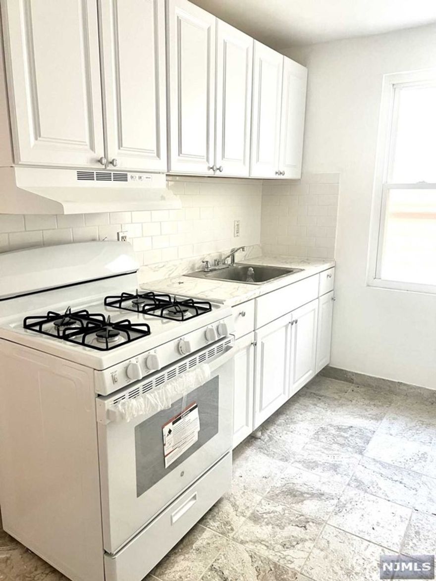 Renovated and Bright 2 bedroom 1 bath apartment located close to all. This first floor unit features Forced hot air/central AC, new floors,new kitchen. 2 generous sized bedrooms. Owner pays for hot water, tenant is responsible for gas and electric. Only 1 month security required.