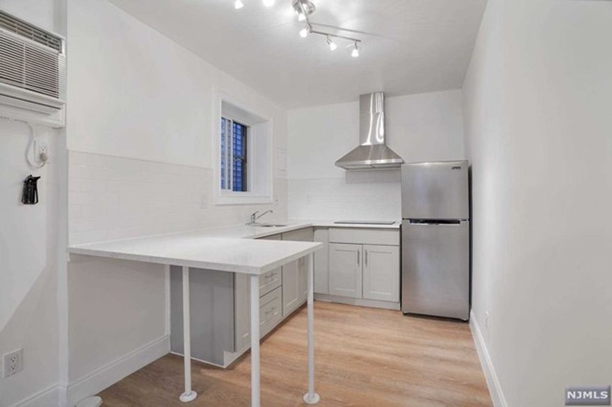 Welcome home to this newly renovated ground level studio apartment located in the heart of Guttenberg. Sitting across 305 square feet of hardwood floor, this studio features quartz countertop, double electric induction cooktop and stainless steel refrigerator. Heat and hot water included plus a laundry room in the premises. Apartment is conveniently located close to public transportation to NYC, shops, restaurants, and parks.