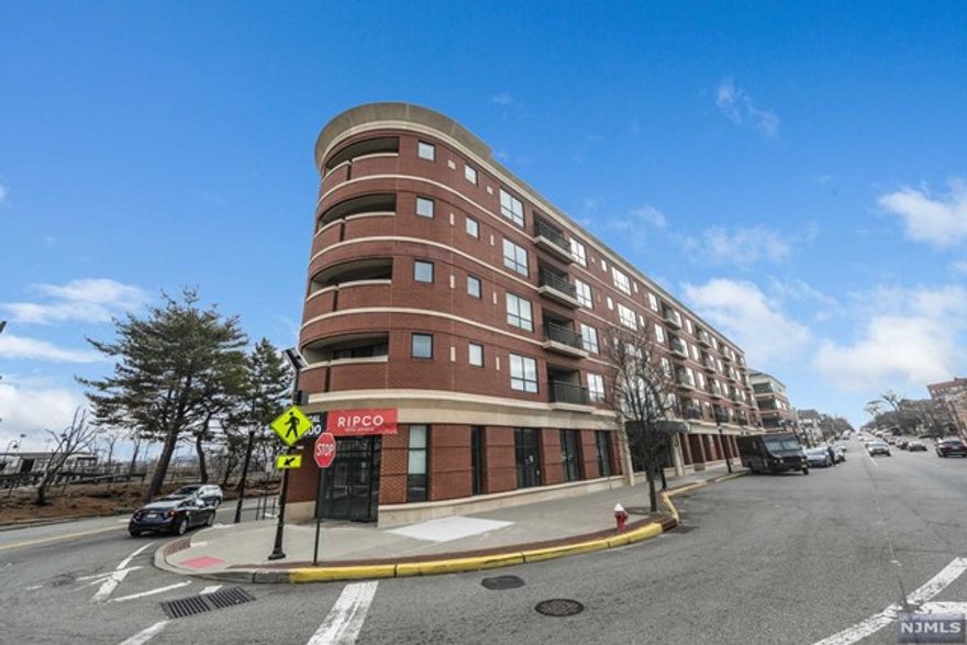 Move right in to this newer elevator building located in the heart of Rutherford and steps to NYC transportation. Large living room and dining area with kitchen that has a breakfast bar and your own private balcony. The primary bedroom suite is a private with a king size bedroom, large walk-in closet, separate shower and jacuzzi tub. The second bedroom has a private bath that is a perfect guest room or office space. Laundry room in the unit and there is a deeded indoor parking space, private storage area and bike room and the building is also pet friendly. Close to all major highways.