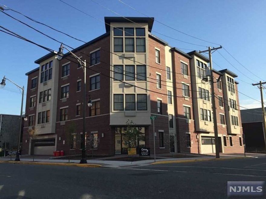 Gorgeous one of a kind ultra modern condo. Boasts open floor plan with modern kitcen featuring quartz counter tops, stainless steel appliances and center island. Master bedroom suite with master bath and closets galore. Cathedral ceilings in living room. Washer/dryer in unit. Hardwood floors and wall to wall carpeting in bedrooms. Indoor parking space included.