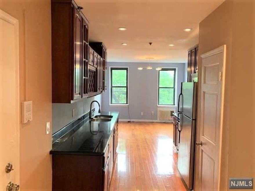 Lovely large updated 1 bedroom Condo on the 2nd floor of a pristine brick building over looking both downtown Jersey City & New York City. Convenience and city living at it's very best in a very affordable way with low taxes and low maintenance. This unit features a large foyer, pre finished hardwood floors, recessed LED lighting, updated electric, kitchen, and bathroom. Bathroom features beautiful ceramic tile, very modern vanity/sink, jacuzzi tube with a heat lamp, and laundry hook ups for your own in unit laundry experience. Plenty of on street parking and mass transportation within steps of your front door. Living room has a large closet & French doors leading to an open dinning area and large kitchen making it possible to have a 2nd semi private bedroom. Great for investor or owner occupied, currently rented for $1800 a month 11/1/-10/31/23.