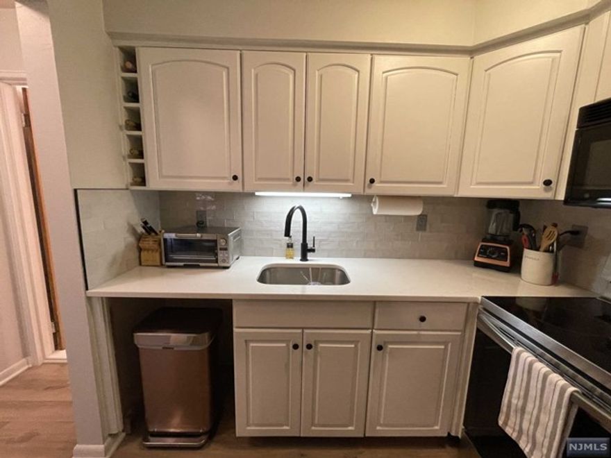 STUNNING RENOVATION! BEAUTIFUL, SUNNY CONDO HAS OPEN FLOOR PLAN. SPACIOUS LIVING ROOM WITH SLIDERS LEADING TO LARGE TERRACE. SEPARATE DINING AREA ADJACENT TO MODERN KITCHEN FEATURING SAMSUNG APPLIANCES, QUARTZ COUNTERTOP, DESIGNER BACKSPLASH AND BUILT IN WINE SHELVING. OVERSIZED BEDROOM OFFERS A DOUBLE CLOSET WITH TONS OF STORAGE. BATHROOM HAS GLASS ENCLOSED SHOWER, ON- TREND BLACK HARDWARE AND WOOD VANITY WITH EXTRA STORAGE. TASTEFUL,BRAND NEW FLOORING THROUGHOUT. COMPLEX OFFERS POOL, BEAUTIFULLY MANICURED GROUNDS, 1 PARKING SPACE, LAUNDRY ON FLOOR. CLOSE TO TRANSPORTATION, SHOPPING AND SO MUCH MORE!! MUST SEE!!