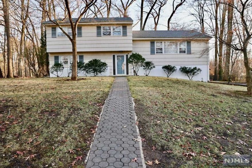 Excellent opportunity to get into the beautiful town of Old Tappan in a renovated 3 bedroom 2.5 bath sugar maple split home. This home sits on a beautiful half acre lot in a great neighborhood. Hardwood floors on first and second floors. Spacious and bright living room, dining room with sliding doors to a Large Deck overlooking the expansive yard. Nicely updated Eat In kitchen with stainless steel appliances, granite countertops and custom cabinetry, Master bedroom with Walk in closet and an additional closet with an ensuite bath, two additional bedrooms and a full bath. Updated family room with a portable fireplace. Award Winning Schools! Close to schools and NYC Transportation.