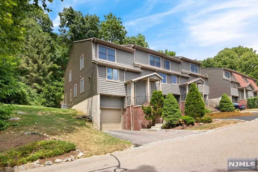 Welcome home! Move in ready and spacious multi level end unit with so much to offer! Open living and dining room along with an eat in kitchen! Enjoy your morning coffee in peace and serenity on your back deck. Gleaming hardwood floors, basement for additional living space, ensuite primary bathroom, generous sized rooms, abundant closet space, oversized garage with plenty of storage, central A/C. There is an additional washer and dryer hookup in the upstairs closet if preferred.