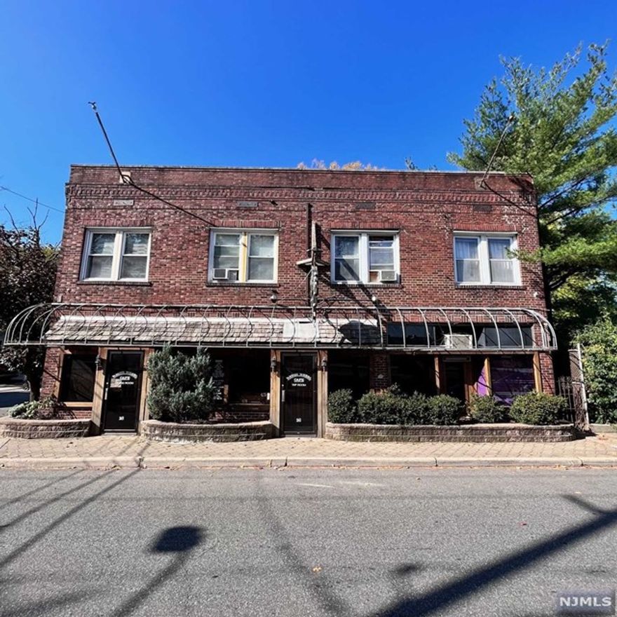 Unique opportunity...mixed use property, previously used as a family owned restaurant for 60+ years. Two residential apartments on second floor. Property is being sold as-is and is in need of updating, but lends itself to a number of options. Lease ground floor or use it for your own business venture while getting income from apartments...two apartments at $1375/mon each. Full basement for storage, parking and two car garage in rear. Located in a Bergenfield redevelopment area.