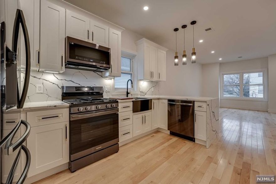 Brand new construction, spectacular 3 BD/1 BA unit spanning 1600 sq ft. on second floor of this two family home absolutely drenched in natural light. This incredible & bright home features Central AC/Forced Hot Air, Washer/Dryer in unit, hardwood floors, quartz countertops and stainless steel appliances in kitchen. All this, plus a bonus loft on the third floor, perfect for office or an in-home oasis. 1 Car parking spot included in rent. Landlord pays cold water and sewer, tenant pays rest of utilities. No pets permitted. Home is located very close to public transportation, including Garfield train station, shopping, houses of worship, schools, parks, and more! Schedule a viewing today!