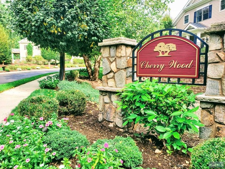 Rare opportunity to live in a luxury townhouse community with gorgeous grounds. 7 Cherrywood was the Model Unit and offers an open floor plan w/ beautiful wood floors, 9 ft. ceiling, crown moldings and wainscoting. Has a great flow with formal dining room, spacious bright kitchen with beautiful soft-closure cabinetries and stacked stone backsplash, breakfast area with sliding glass doors to the deck, and family room with gas fireplace. Second floor features a Master Suite with a beautiful master bath--jetted tub, double vanities, separate shower and water/toilet closet. Two additional bedrooms and a large full bath completes this level. Finished basement offers high ceiling, a large recreation room, 4th Br, full bath and a separate nook for a home office. Don't miss out! These townhouses are rarely on the market. Exceptional school system, easy NYC commute by by car, bus & train.