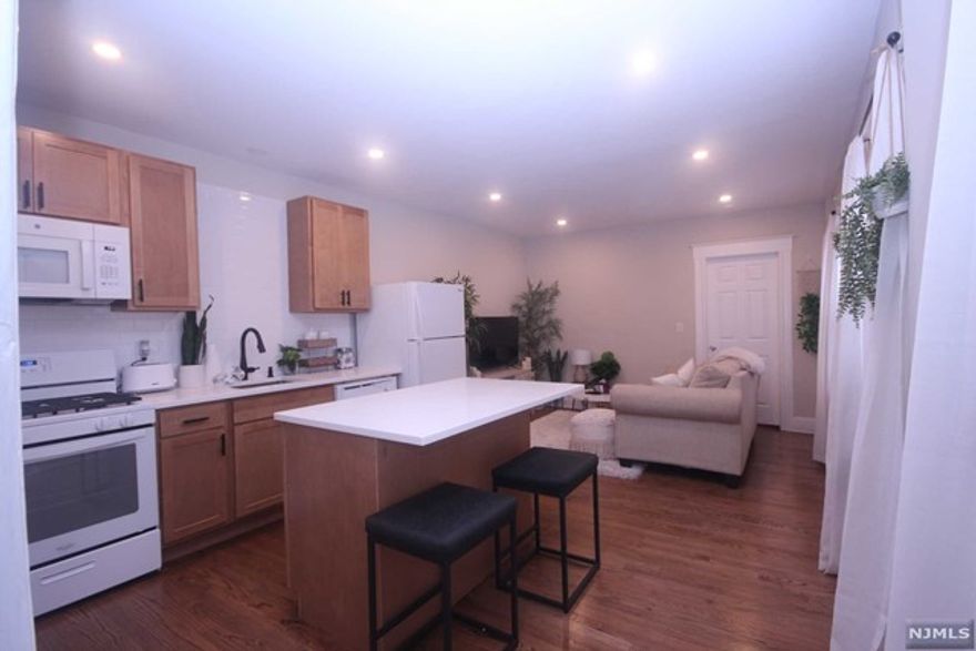 Beautifully recently renovated apartment with open floor plan. Kit w/ center island, quartz countertop, open to living area, new hardwood floors, new bath. Refrigerator, D/W, microwave provided by landlord. Tenant pays gas and electric. One off-street parking space provided. Close to NY bus #161, shopping and park. Pets conditional. Listing agents related to landlord.