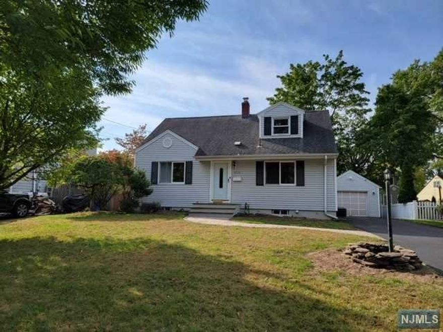 Located in the lovely town of Ridgewood, this updated home offers spacious living and dining rooms which features hardwood floors, leading to a large kitchen with granite countertops. With four generously sized bedrooms and two full bathrooms, there's plenty of space for comfortable living. The fully finished basement includes a large recreation room and two additional rooms, perfect for a home office or den. Outside, enjoy the well-maintained yard with a patio area. This home, situated in a community with top-rated schools and a welcoming atmosphere!