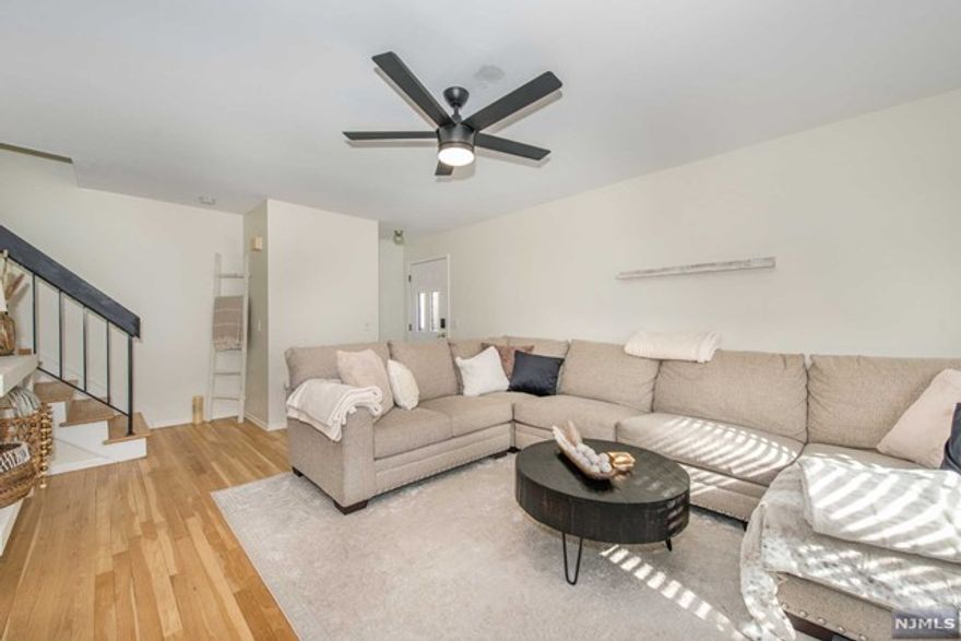 NEWLY RENOVATED MOVE-IN-READY TOWNHOME! This END UNIT is featuring 2 Spacious Bedrooms, 2.5 Baths, Double Balcony & Large Finished Basement. Brand New Appliances, Hot Water Heater, Freshly Painted Rooms & Cabinets, & Newly Refinished Hardwood Floors & Railings Throughout! So Many Upgrades! The first floor features Spacious Open Concept Living, w/ Formal Dining Room, Sliding Door to Deck, Large Eat-in Kitchen & Powder Room. The second level is complete with MASTER BEDROOM SUITE w/private bath & two large closets, Second Bedroom w/ Walk-in closet & sliding door to balcony, & Second Full Bath; The Lower Level Features Family/Rec room, Bonus Office/Bedroom space, Laundry & Storage. GREAT LOCATION: WALK TO ALL SHOPPING AND NYC BUS. Enjoy Onsite Amenities to Include POOL, PLAYGROUND, BASKETBALL & TENNIS.