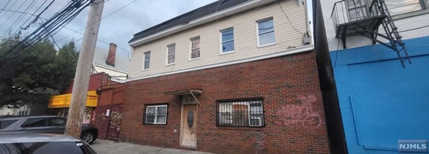 Discover an exceptional investment opportunity in North Newark with this 4-unit residential property with one large commercial garage. Situated in a highly desirable neighborhood. This property features two recently renovated units, ensuring contemporary and attractive living spaces. Located just a stone's throw away from Branch Brook Park, NJPAC, and the Prudential Center, it also provides easy access to nearby schools, shops, and public transportation options, including the Light Rail to Penn Station. Every unit is equipped with separate electric meters, simplifying utility management for both owners and tenants. Additionally, one spacious commercial garage (Rented) and a finished basement that feature two kitchens and two bathrooms allowing various possibilities. This property boasts a strong rental income potential and the prospect of long-term appreciation. Don't let this outstanding investment slip through your fingers. Property being sold "AS IS,Where IS".